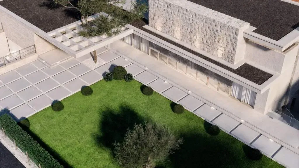Aerial view of a house with a planted inner courtyard